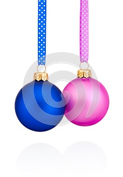 Blue and pink Christmas ball hanging on ribbon Isolated on white