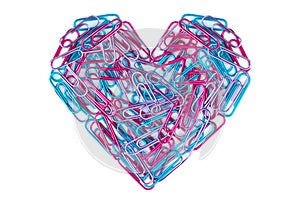 Blue and pink paper clips arranged in heart shape