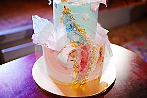 blue and pink two-tier cakes with gold decor for the girl's eighteenth birthday.