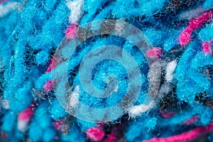 Blue and pink wool threads as abstract background