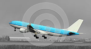 Blue plane taking off