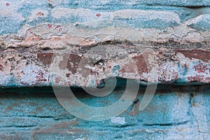 Blue plaster brick wall texture. Old retro building background copy space. Orange stones surface,detailed stone backdrop