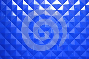 Blue plastic background with geometric shapes