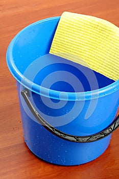 Blue plastic bucket and napkin