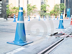 Blue plastic cone on road to be traffic sign