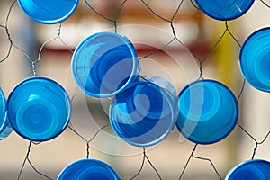 Blue plastic glasses in a net