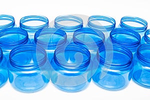 Blue plastic jars on a white background isolate, polyethylene terephthalate, tara