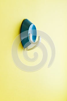 Blue plastic old clothes hook for a hanger