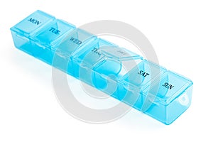 Blue plastic organizer, for pills isolated on white background. Close-up on compartments pill case with clip lids medicine. Daily