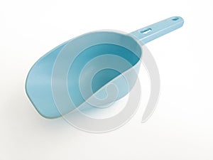 Blue plastic pet food shovel isolated on white background. Empty plastic dog and pet food spatula, spoon for dry food, measuring