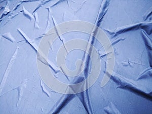 The Blue Plastic sheet on the Car for dust and rain protection. photo