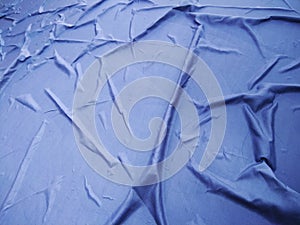 The Blue Plastic sheet on the Car for dust and rain protection. photo