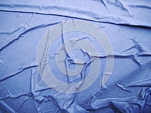 The Blue Plastic sheet on the Car for dust and rain protection. photo