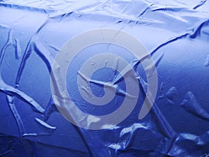 The Blue Plastic sheet on the Car for dust and rain protection. photo