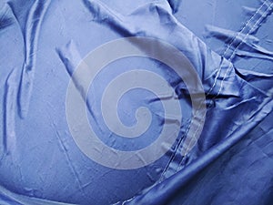 The Blue Plastic sheet on the Car for dust and rain protection. photo