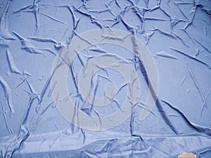 The Blue Plastic sheet on the Car for dust and rain protection. photo