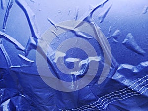 The Blue Plastic sheet on the Car for dust and rain protection. photo