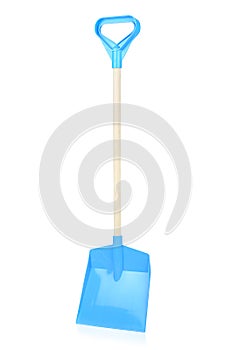 Blue plastic shovel isolated on a white background, close-up. Children's toys for playing in the sandbox. Games for