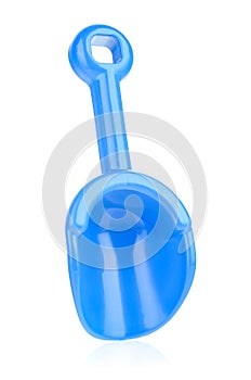 Blue plastic shovel isolated on a white background, close-up. Children's toys for playing in the sandbox. Games for