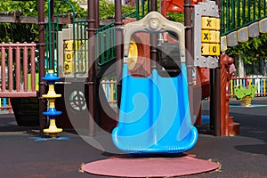 Plastic slide on empty multicolored playground