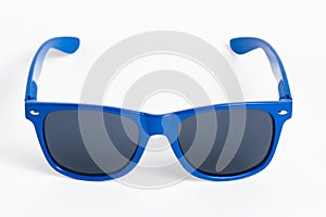 Blue plastic sunglasses isolated on white