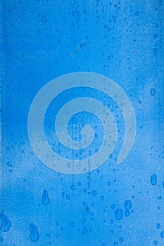 Blue plastic texture with raindrops