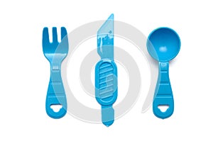 Blue plastic toys of a fork, scoop and knife