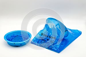 Blue plastic vomit bag isolated on white