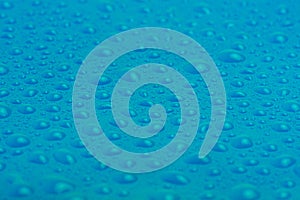 Blue plastic with water drops macro photo. Abstract blue background