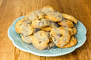 Blue plate of chocolate chip cookies