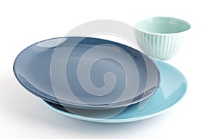 blue plates and a cup on a light background.