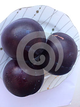 Blue plums on a plate
