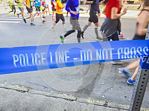 Blue police line during a city marathon