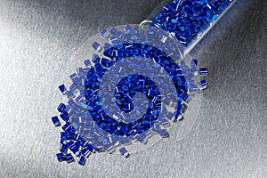 Blue polymer granules in test glass