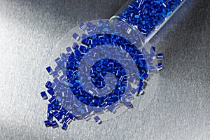 Blue polymer granules in test glass photo