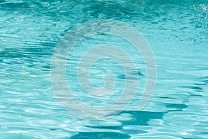 Blue pool water reflecting sun rippled details.surface of blue pool, bottom of water in swimming pool