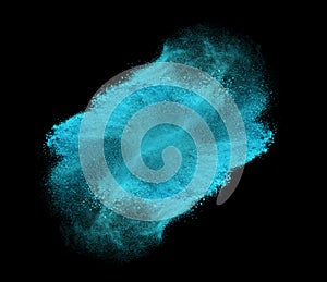 Blue powder explosion isolated on black background