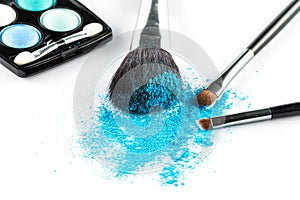 Blue Powder Eyeshadow on a Brush with Make up Palette