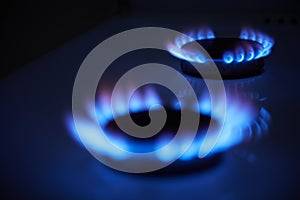 Blue propane gas flame. Burning gas. Kitchen stove burner. Natural gas market concept image with copyspace