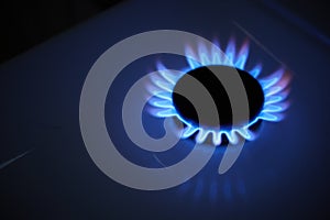 Blue propane gas flame. Burning gas. Kitchen stove burner. Natural gas market concept image with copyspace