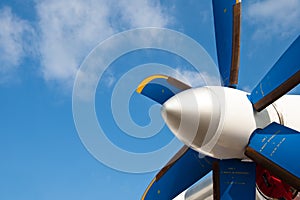 Blue propeller of white airplane
