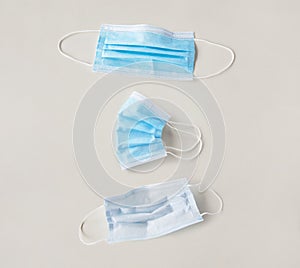 Blue protective medical mask presented in different sides  - covid 19 concept