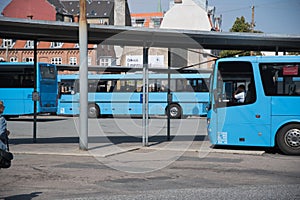 Blue pubblic bus at the bus station in Aarhus