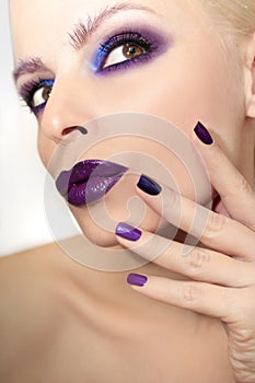 Blue purple fashion multicolored manicure and makeup .