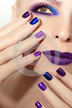 Blue purple fashion multicolored manicure and makeup .