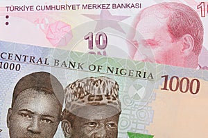 A blue, purple and green one thousand  naira note from Nigeria paired with a red, ten lira bank note from Turkey.