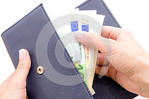 Blue purse with euros in the hands on white background