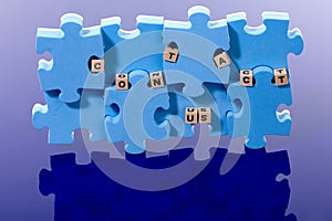 Blue puzzle with wood letter