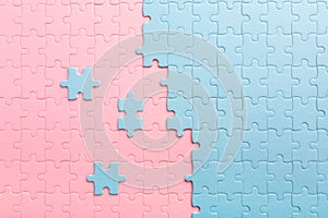 Blue puzzles and pink puzzles with separate elements