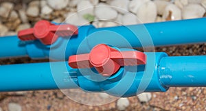 Blue PVC pipe and valve